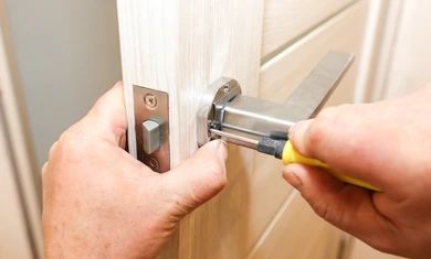man-installing-doors-handle-repair-260nw-1408790957.jpg